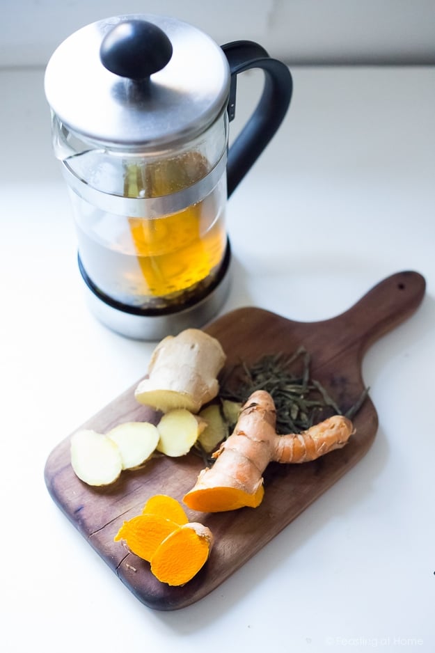 Ayurvedic Detox Tea- a "daily" drink made with fresh turmeric, ginger and whole spices to help aid the liver, flush out toxins and restore balance in the body. Healing and restorative. #detoxtea #turmerictea #ayurvedictea #tea #cleansingtea