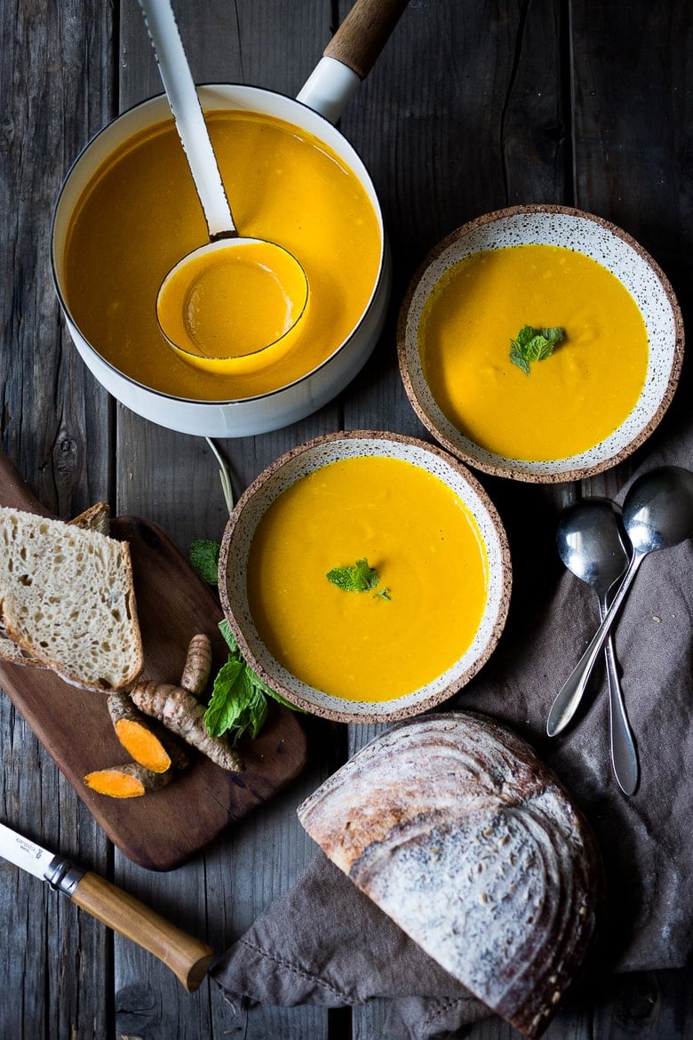 20 Mouthwatering VEGETARIAN Soups for FALL! ||Creamy Carrot Turmeric Soup with Coconut Milk and ginger. Fresh turmeric and mint gives this soup its exotic flavor. Vegan. | www.feastingathome.com