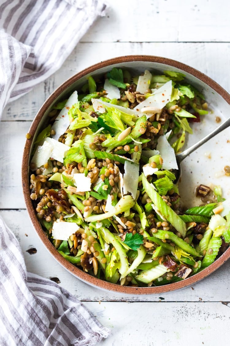 25 Tasty Lentil Recipes - that are not bland or boring! | Celery Salad with lentils, dates and almonds - a delicious make ahead salad that keeps for several days in the fridge. Keep it vegan or add shaved pecorino! #celerysalad #lentilsalad #healthysalad #salad #vegansalad