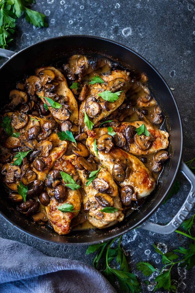 This flavorful, easy Chicken Marsala recipe is rich, earthy, and complex, with double the mushrooms in a creamy Marsala wine sauce. Serve Chicken Marsala over a bowl of creamy polenta with a leafy green salad, and dinner is ready.  Includes a Video.