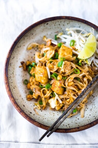 Authentic Pad Thai is easy to make at home! Learn the secret to the best Pad Thai- this recipe is bursting with Thai flavor! Vegan-adaptable.
