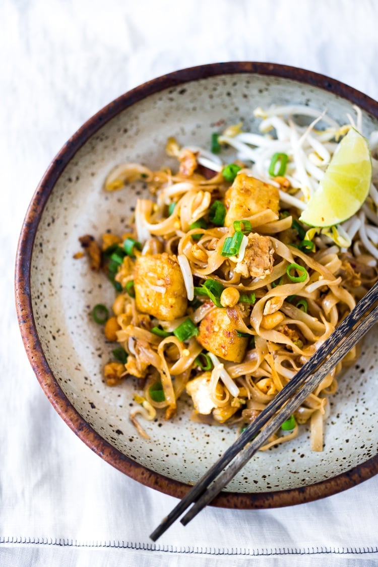 40 Mouthwatering Vegan Dinner Recipes!| PAD THAI- an easy, authentic recipe with made with accessible ingredients that can be made with chicken or tofu! Gluten free, Vegan adaptable with Incredible flavor ! | #authenticpadthai #easypadthai #padthai #padthainoodles www.feastingathome.com