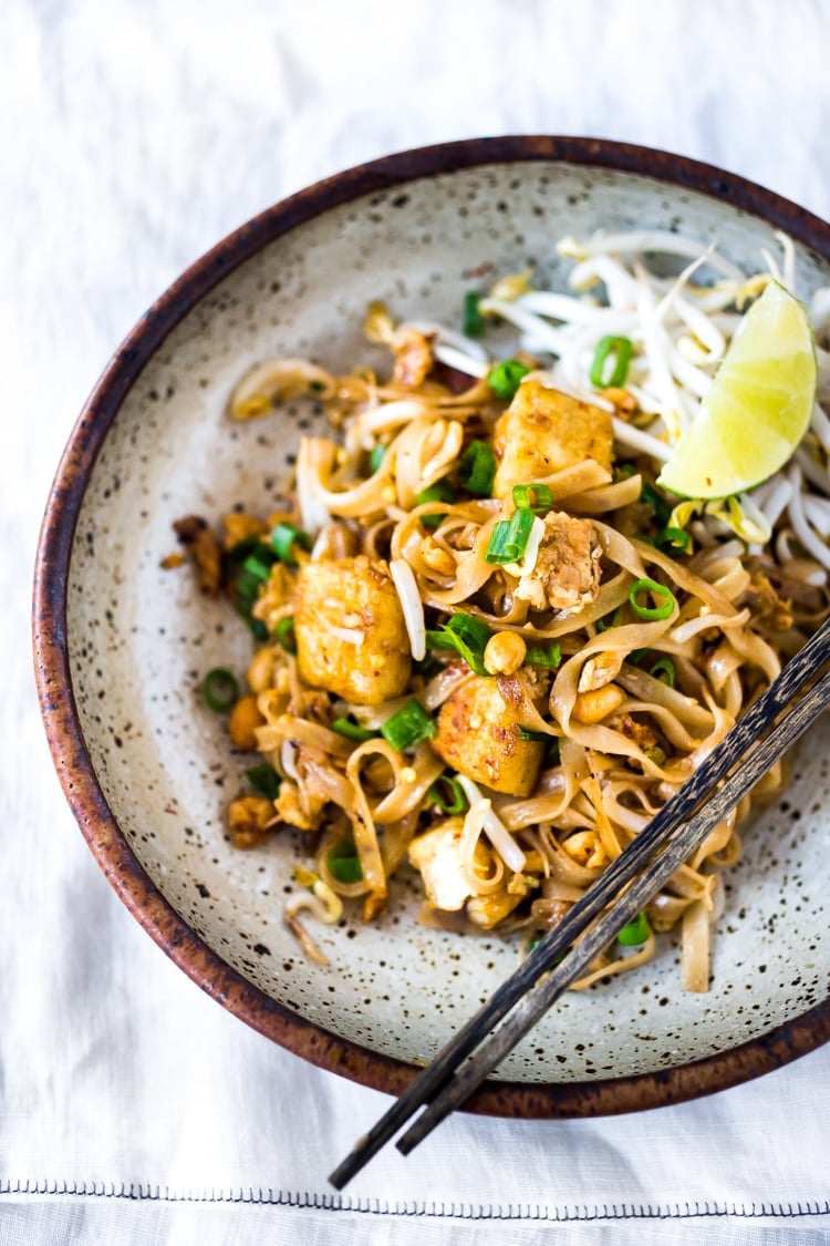 15 MINUTE PAD THAI- an easy & authentic recipe made with simple ingredients! Make with chicken, shrimp or tofu! Gluten free, Vegan adaptable with Incredible flavor ! | Plus more FAST healthy weeknight dinners! | #authenticpadthai #easypadthai #padthai #padthainoodles #weeknightdinners www.feastingathome.com