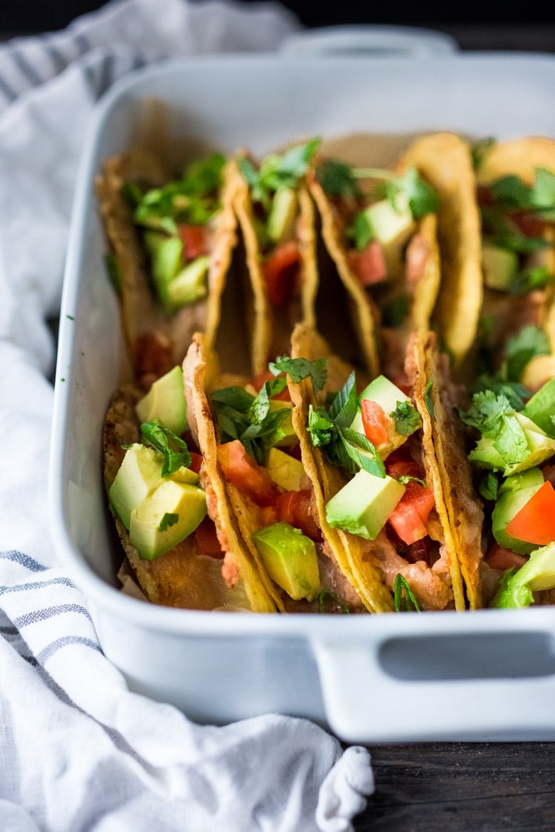 40 EASY Dinners Ideas | Healthy Baked Vegetarian Tacos - Kid friendly and just 15 minutes of prep before going into the oven to bake. | #tacos #bakedtacos www.feastingathome.com