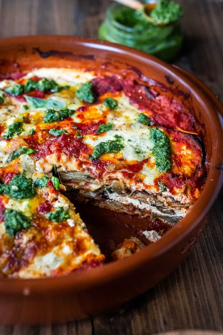  Eggplant Lasagna made roasted eggplant, no-boil noodles and topped with Arugula Pesto. A delicious, healthy vegetarian dinner recipe that is comforting and nourishing. #eggplantlasagna