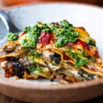 An EASY Eggplant Lasagna made with no-boil noodles and topped with Arugula Pesto. A delicious, healthy vegetarian dinner recipe that is comforting and nourishing.