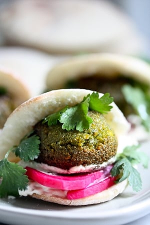 40 Mouthwatering Vegan Dinner Recipes!| Falafels with Tahini Sauce. This authentic recipe is made with soaked, uncooked chickpeas and hands-down has the BEST texture and flavor! So easy! Bake them or pan-sear them. Great in wraps, bowls, or salads. |  #falafel #falafels #falafelrecipe #falafelsalad, #bowl #veganfalafelrecipe #bakedfalafel #vegan #easyfalafel