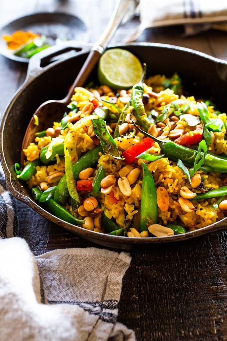 40 Easy Dinner Ideas! This fragrant, turmeric infused, Indian Fried Rice is full of healthy veggies and can be made in under 30 minutes. Vegetarian, Gluten-free and Vegan adaptable, it is a fast and easy weeknight meal- great for using up leftover rice and veggies in the fridge.