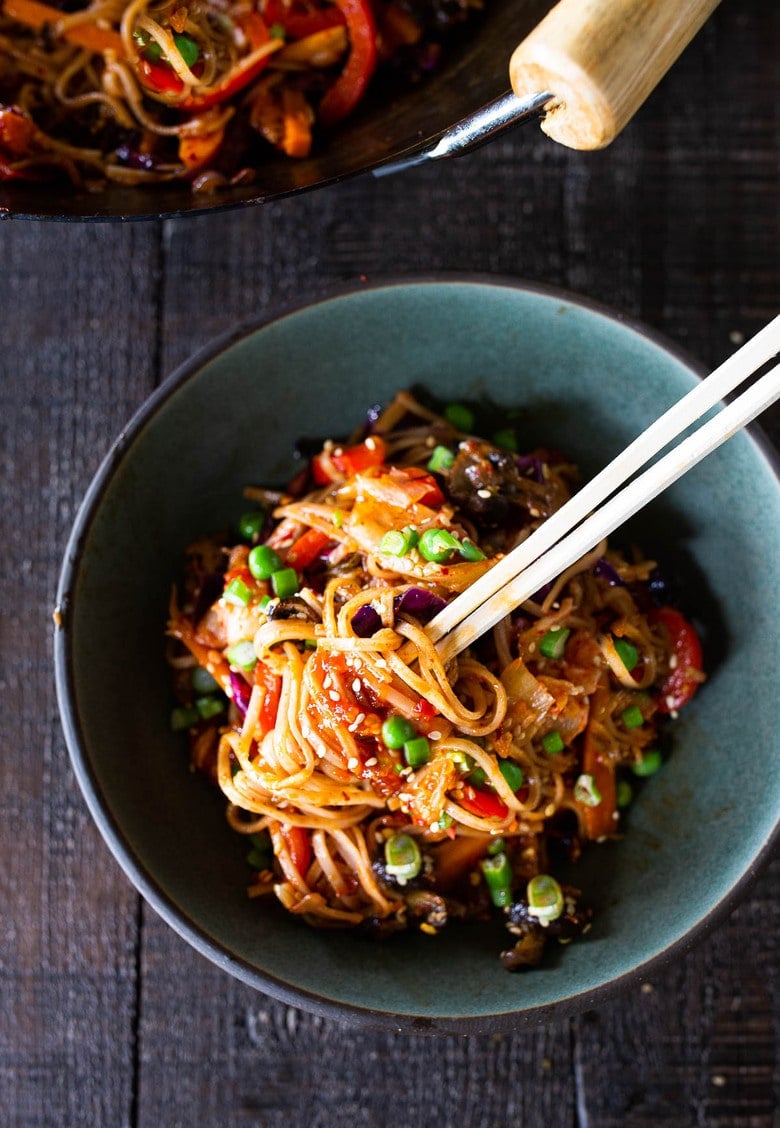 A flavorful recipe for Kimchi Noodles stir-fried with healthy veggies. Keep it vegan or add an egg, crispy tofu, chicken or shrimp! 