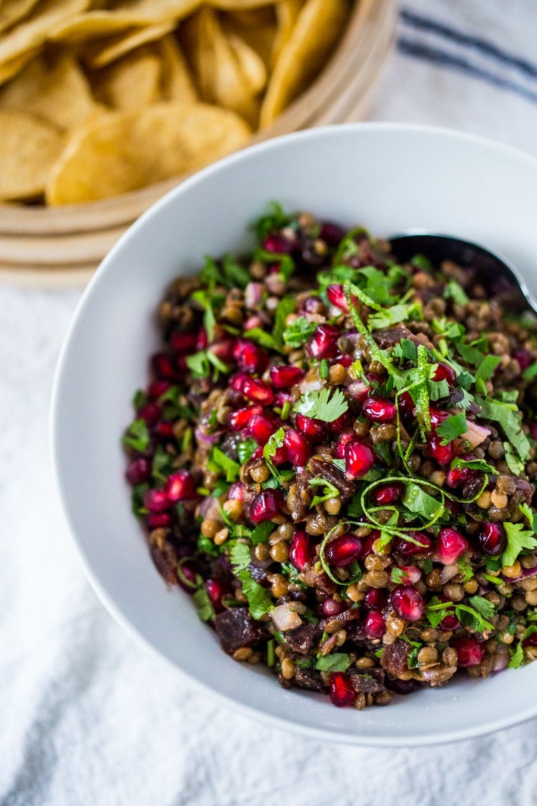 Palouse Caviar!  A take on Texas Caviar, this Lentil Dip called Palouse Caviar is made w/ Northwest Palouse grown lentils, pomegranate, avocado, lime. Served with corn chips for a festive healthy, vegan GF appetizer.