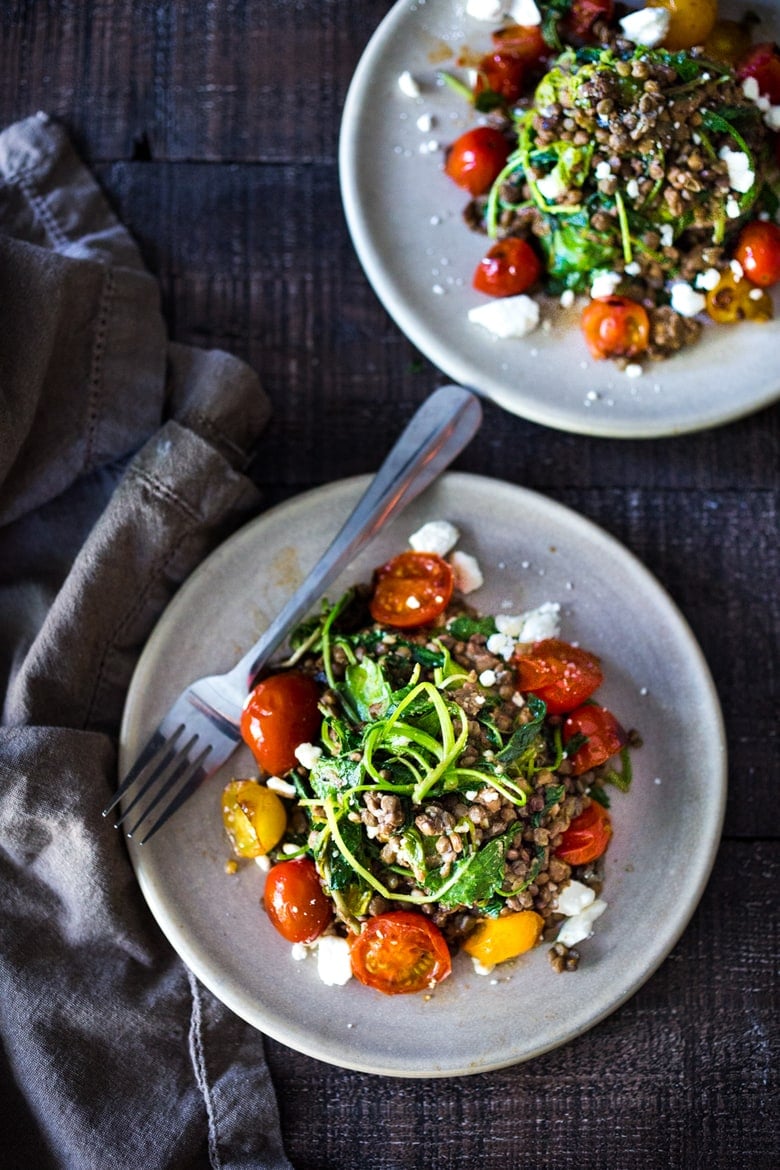 25 BEST Lentil Recipes! Lentils with Blistered Tomatoes and Kale- a simple vegetarian lentil recipe seasoned with Middle Eastern spices & topped with feta. Healthy, tasty! | www.feastingathome.com #halfcuphabit #lentilrecipes #vegetarianlentils 