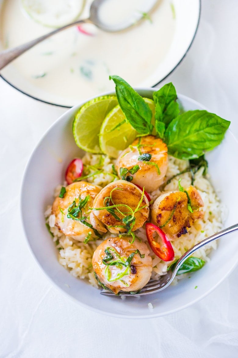 20 BEST FISH RECIPES | Feasting at Home: Seared Scallops with Coconut Lemongrass Sauce, fresh basil and lime zest. Healthy and delicious, this Thai-inspired dinner is FULL of amazing flavor and easy and quick to make. Feel free to substitute halibut, black cod or shrimp for the scallops! 
