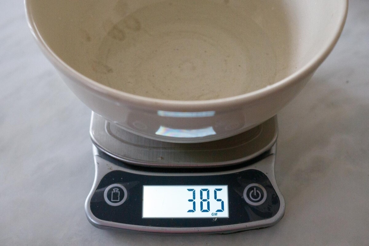 weighing water in a bowl.