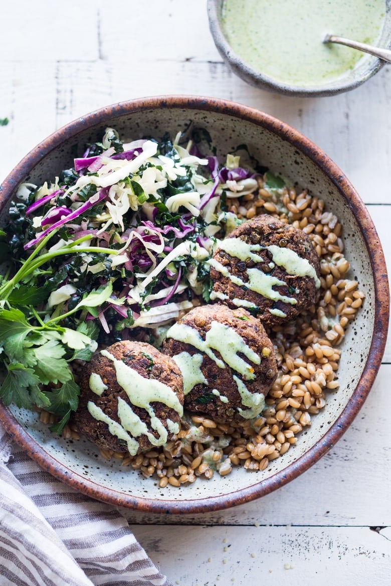 25 Lentil Recipes! | Vegan Lentil Cakes made with walnuts and mushrooms topped with flavorful Zhoug yogurt.